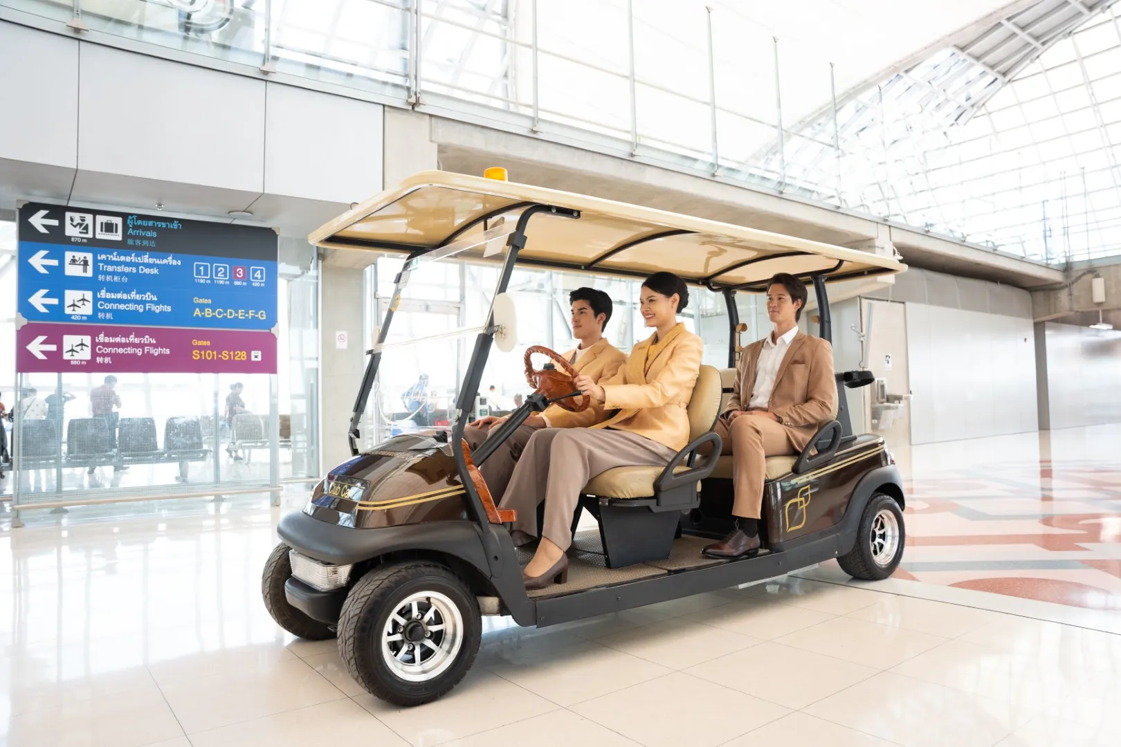 Thailand Privilege Elite Personal Assistants drive a member by electric cart from the arrival gate at Suvarnabhumi airport