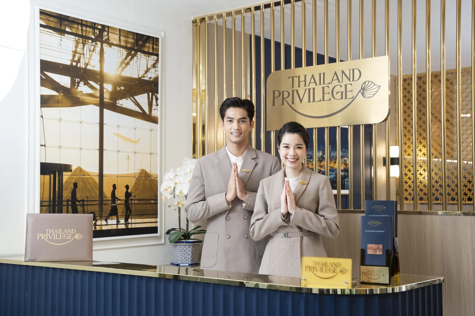 Thailand Privilege staff welcoming a member with a wai in the VIP lounge — Thailand Privilege Visa complete guide 2026