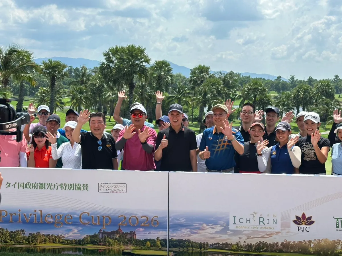 Players and hosts waving behind the Thailand Privilege Cup 2026 banner at Amata Spring Country Club